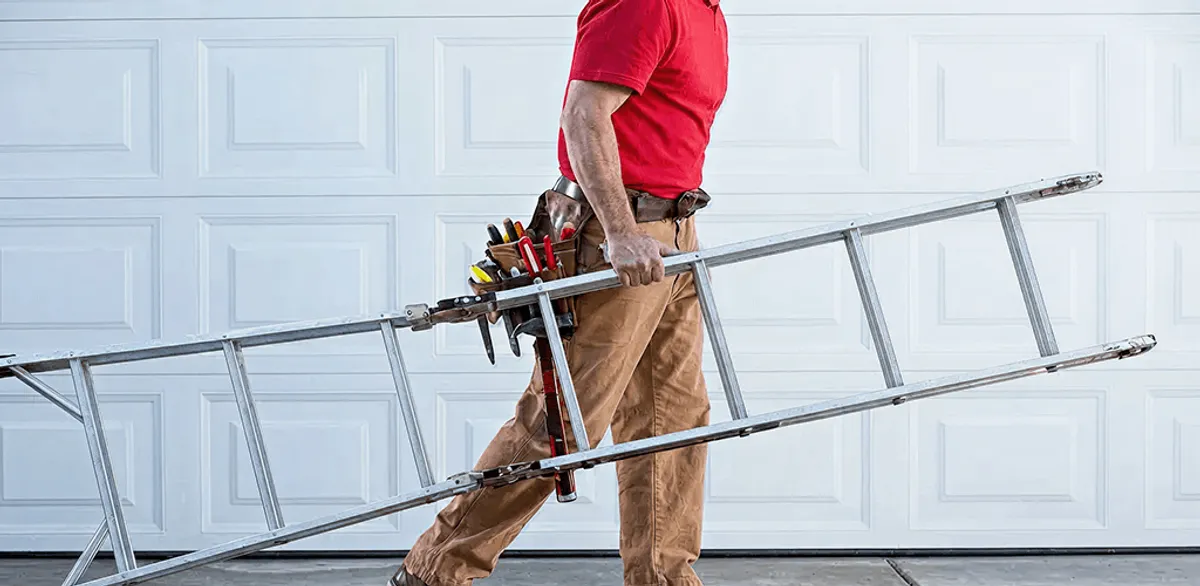 Garage door repair technician arriving with tools and ladder in Arlington, TX