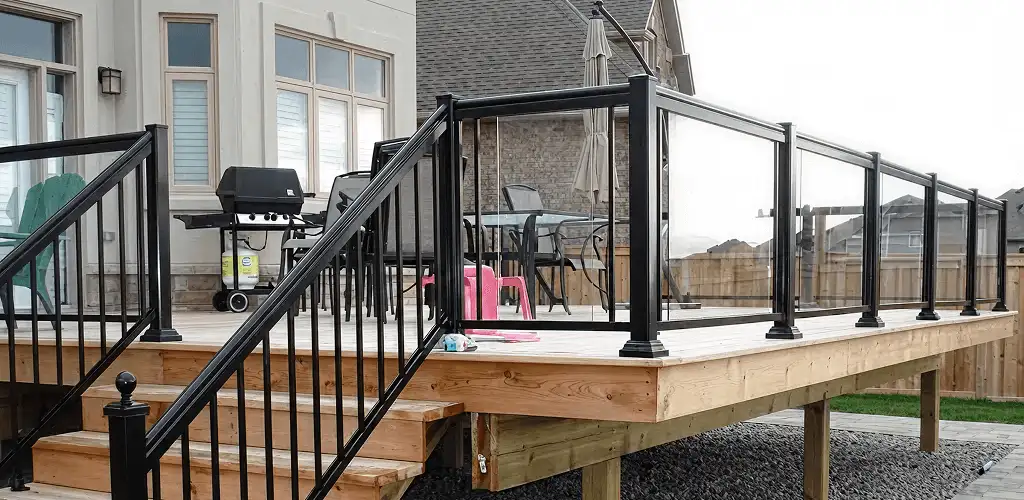 Handrail installation on a deck staircase for safety and code compliance in Arlington, TX