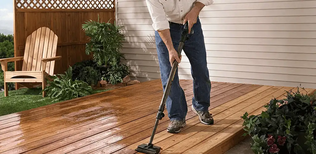 Deck staining service applying stain to a backyard wood deck in Arlington, TX